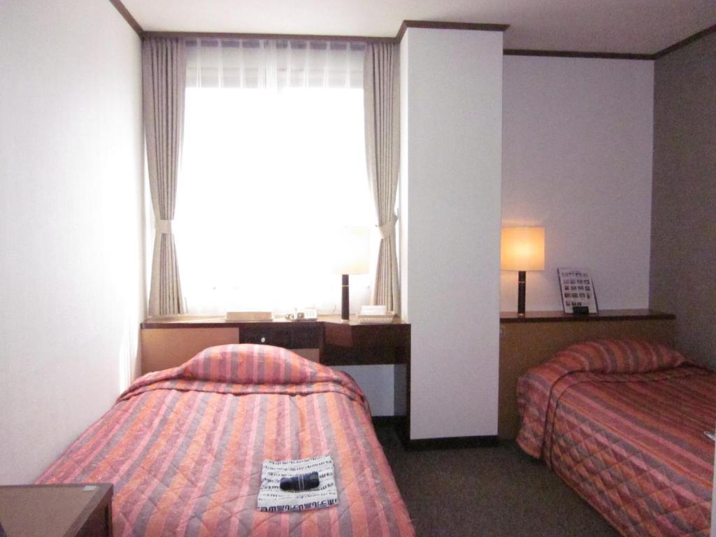Ayun Takayama Central Hotel Quarto foto